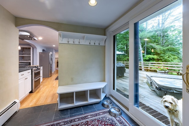 mudroom with a baseboard radiator and tile patterned floors