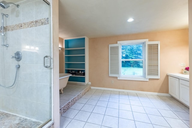 bathroom featuring an enclosed shower, tile patterned floors, and vanity