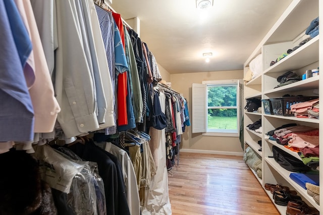 walk in closet featuring light hardwood / wood-style flooring