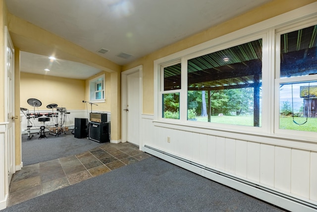 interior space with a baseboard radiator