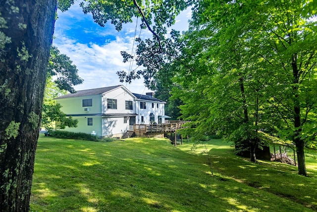 view of yard featuring a wooden deck