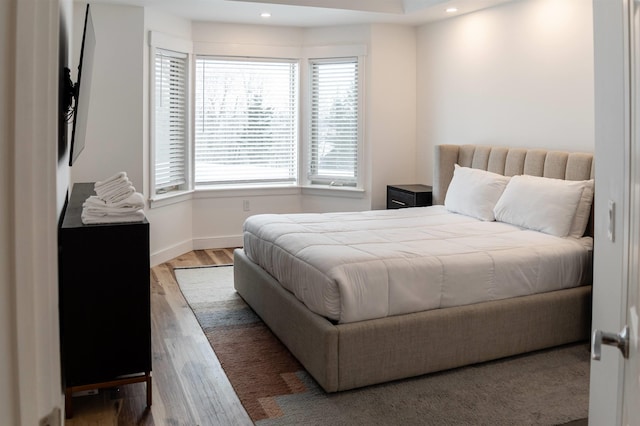 bedroom with hardwood / wood-style floors