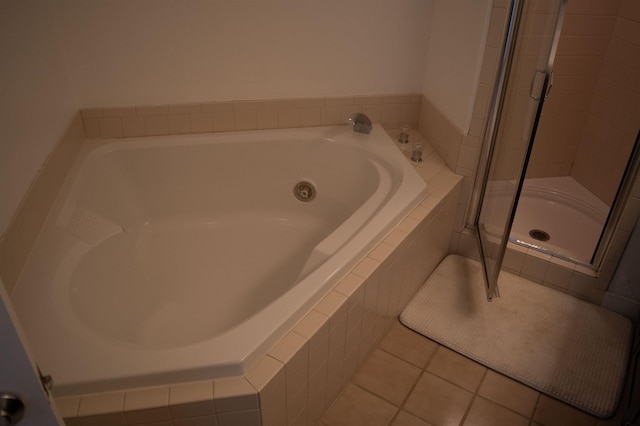 bathroom with tile patterned floors and independent shower and bath