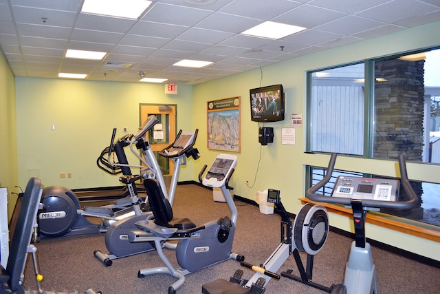 exercise room featuring a drop ceiling