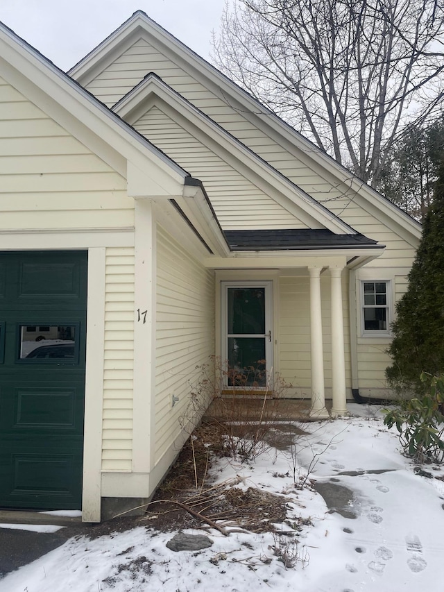 view of snow covered property entrance