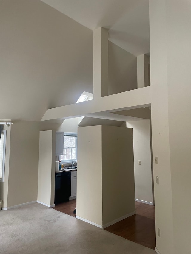 interior space featuring sink and vaulted ceiling