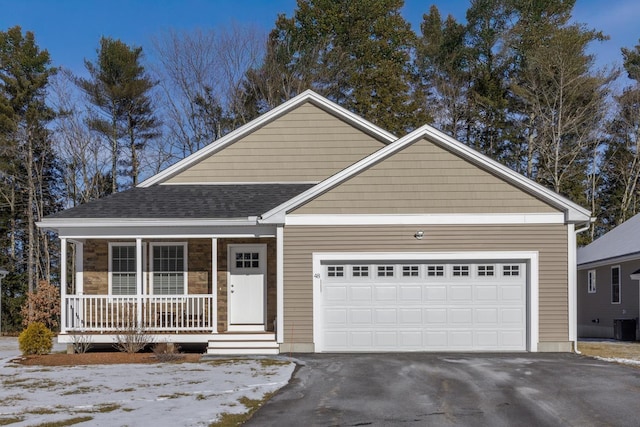 view of front facade with a garage and covered porch