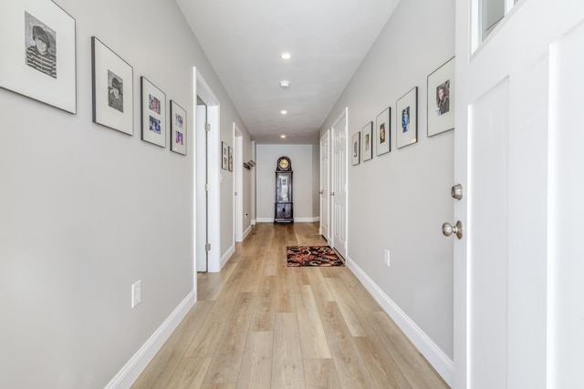 corridor featuring light hardwood / wood-style floors