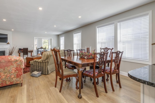 dining space featuring light wood-type flooring