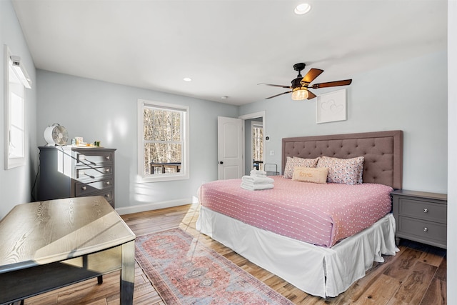 bedroom featuring wood-type flooring and ceiling fan