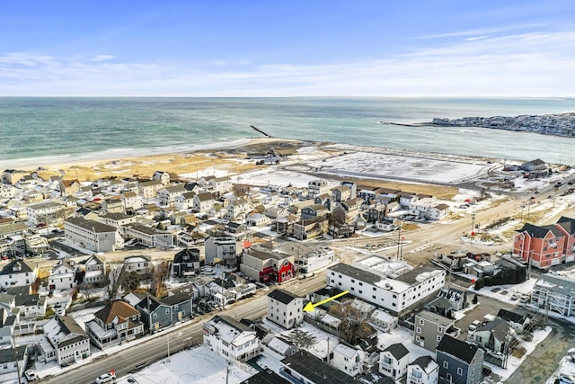 bird's eye view featuring a water view and a view of the beach