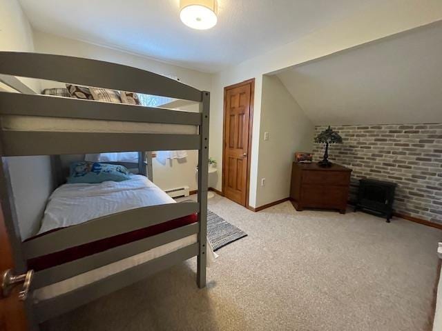 bedroom featuring brick wall, lofted ceiling, and light colored carpet