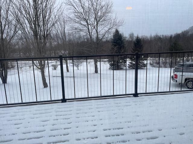 view of snow covered gate