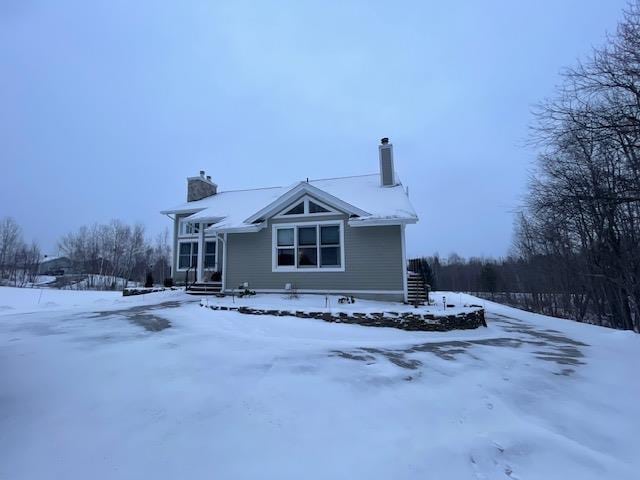 view of snow covered house