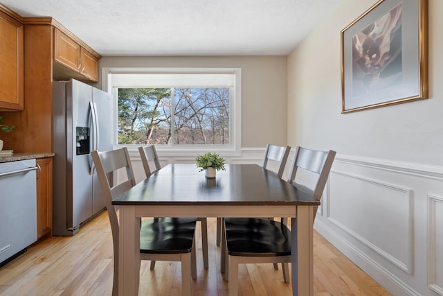 dining area with light hardwood / wood-style flooring