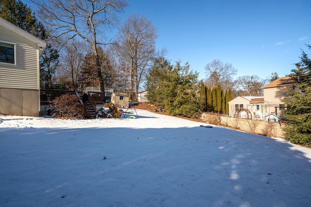 view of yard covered in snow