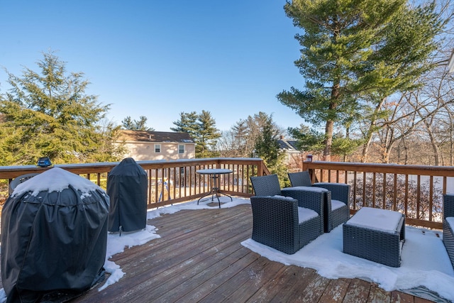 wooden deck with grilling area