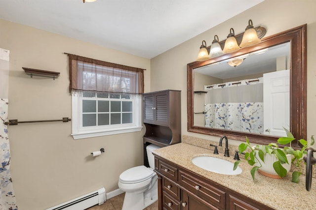 bathroom featuring baseboard heating, tile patterned floors, vanity, and toilet