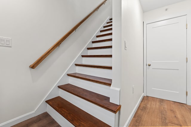 stairway with wood-type flooring