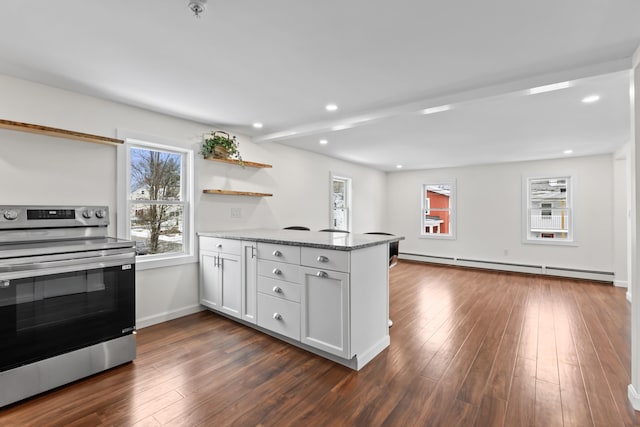 kitchen with white cabinetry, kitchen peninsula, light stone countertops, a baseboard radiator, and electric range