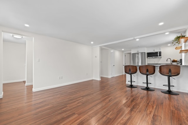 interior space with sink and dark hardwood / wood-style floors