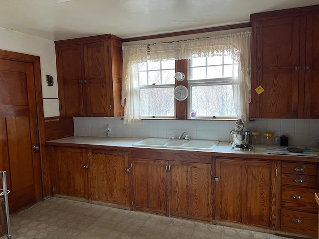 kitchen with sink and decorative backsplash