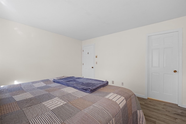 bedroom featuring dark wood-type flooring