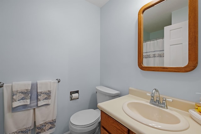 bathroom with toilet and vanity