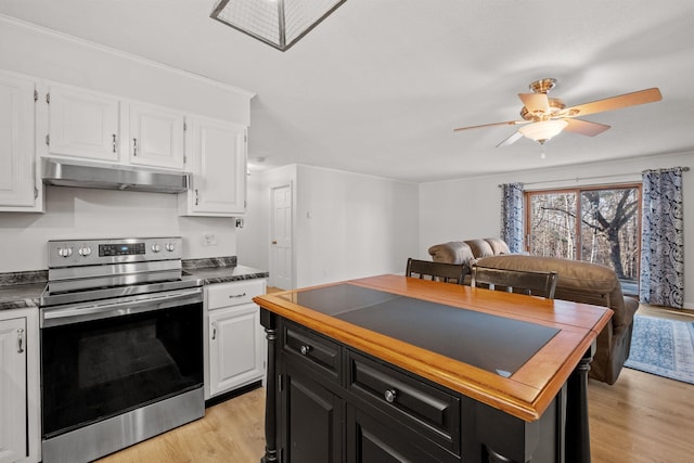 kitchen with white cabinets, ceiling fan, light wood-type flooring, and electric stove