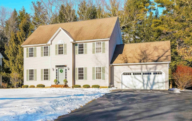 colonial home featuring a garage