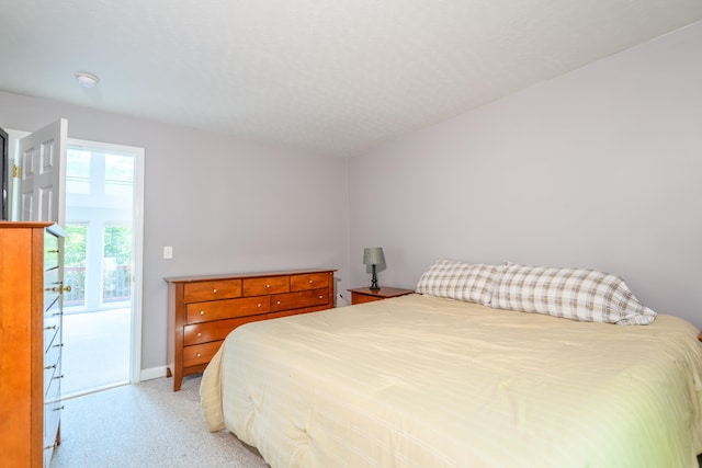 bedroom featuring access to outside