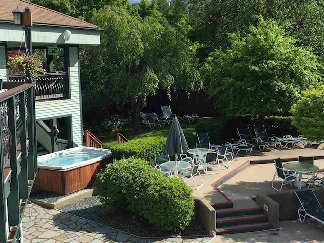 view of patio with a hot tub