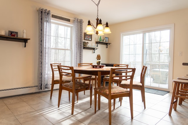 dining space with baseboard heating, an inviting chandelier, and light tile patterned floors