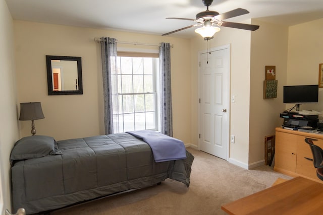 carpeted bedroom featuring ceiling fan