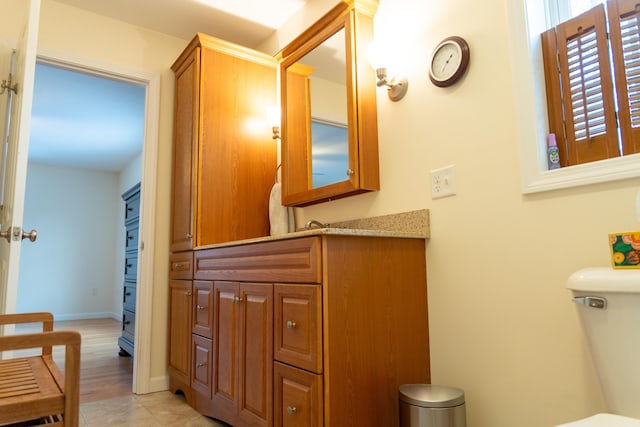 bathroom with toilet and vanity