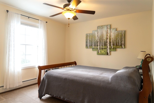 carpeted bedroom featuring ceiling fan and baseboard heating