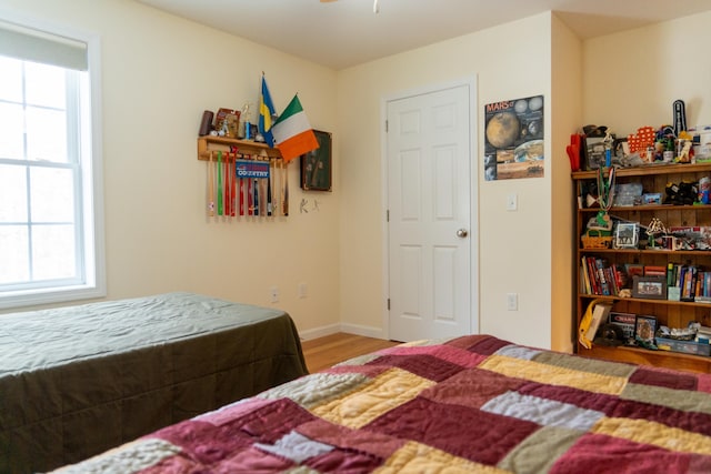 bedroom with wood-type flooring