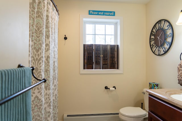 bathroom featuring a baseboard radiator, vanity, and toilet