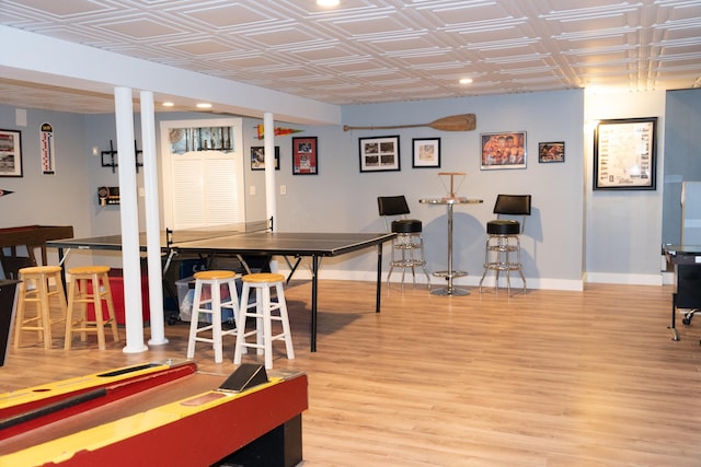 game room with wood-type flooring