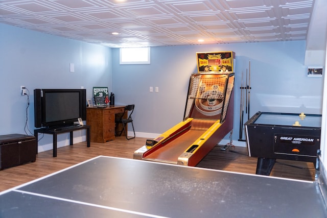 game room with hardwood / wood-style floors