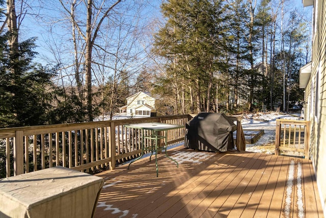 wooden deck featuring grilling area