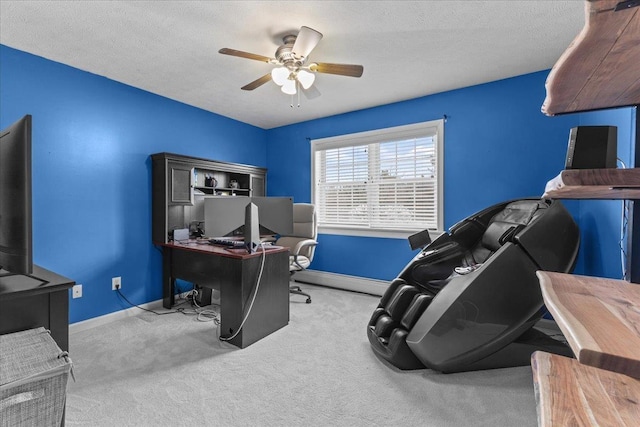 carpeted office space with a textured ceiling, ceiling fan, and baseboard heating