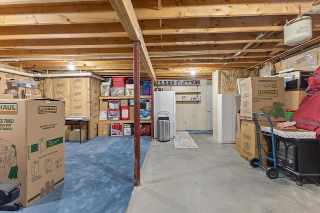 basement featuring white refrigerator