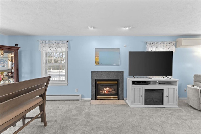 interior space with a baseboard radiator, a textured ceiling, light carpet, and a wall mounted air conditioner