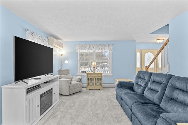 living room featuring a baseboard radiator, light carpet, a wall unit AC, and a textured ceiling