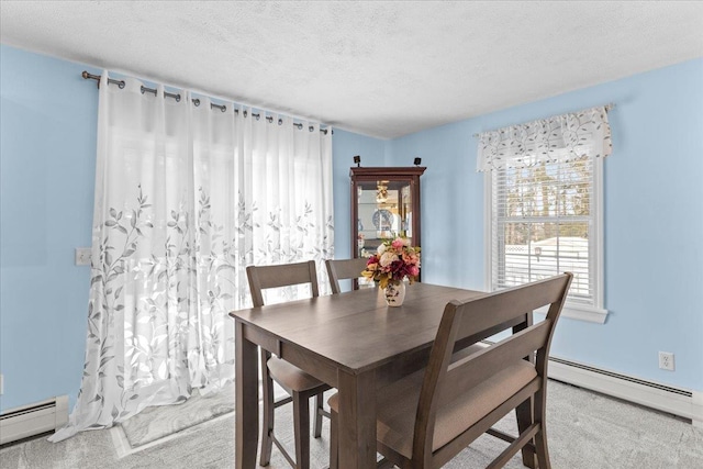 carpeted dining room with a baseboard heating unit and a textured ceiling