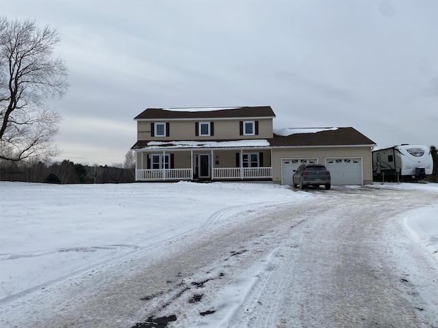 view of front property with a garage and a porch