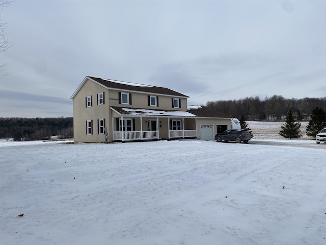 view of front facade featuring a garage and a porch