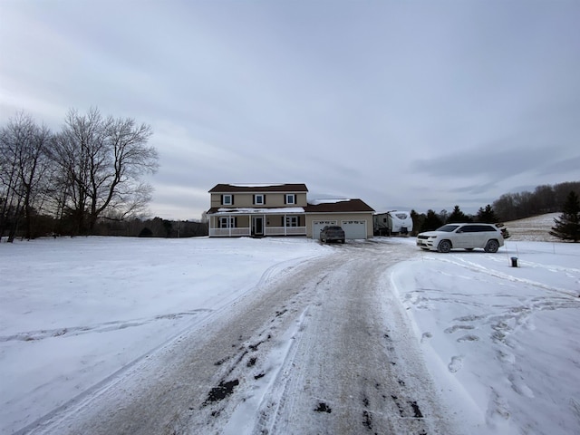 view of front of house with a porch and a garage