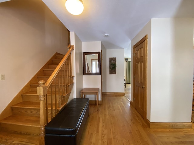 hall with hardwood / wood-style floors